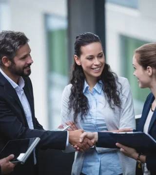 businesspeople-having-discussion-office